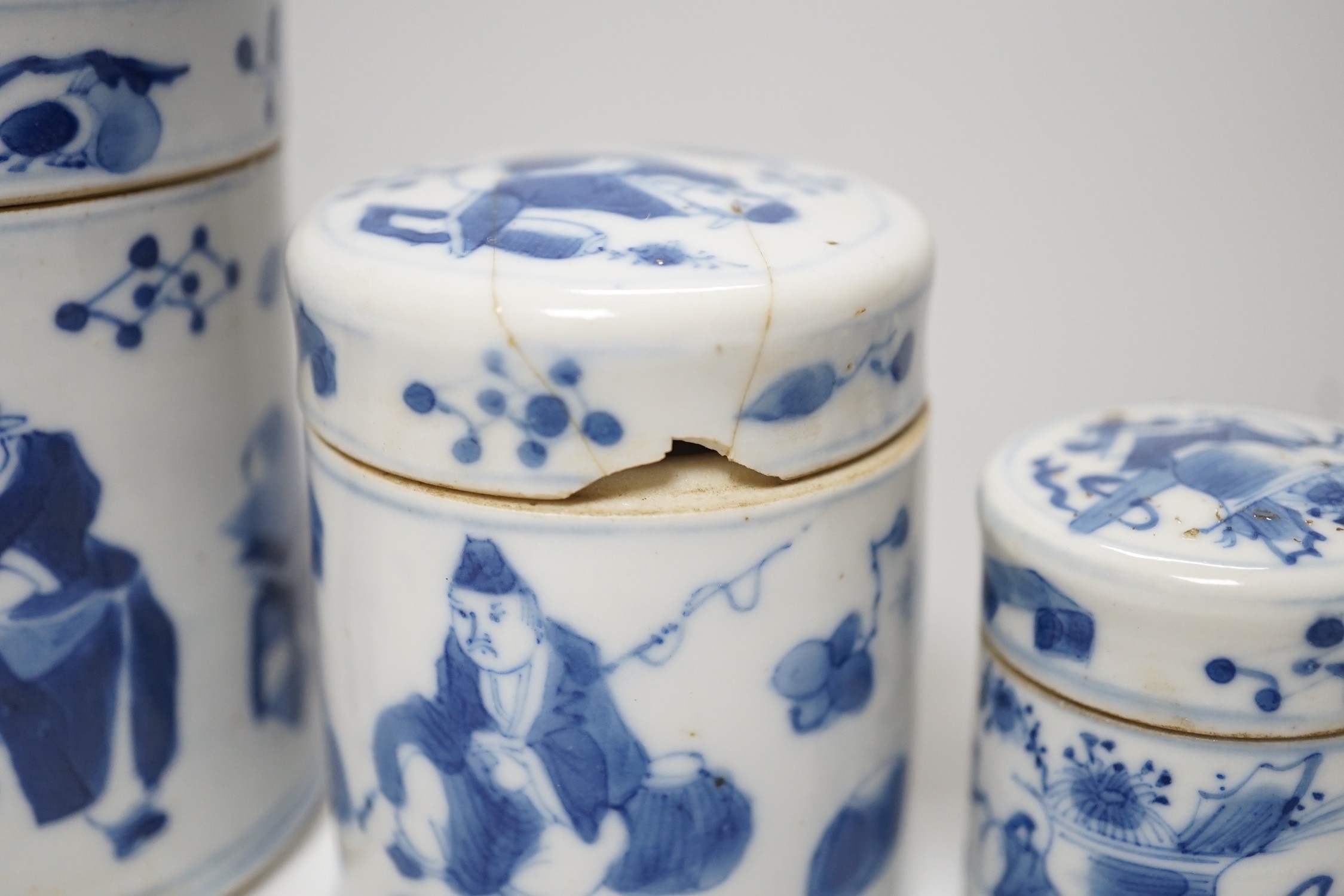 A set of four 19th century Chinese graduated blue and white jars and covers and a small jar with another design (5). Tallest 12cm